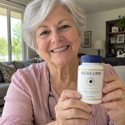 Dorothy M., Oculume customer, holding a bottle of Oculume at home